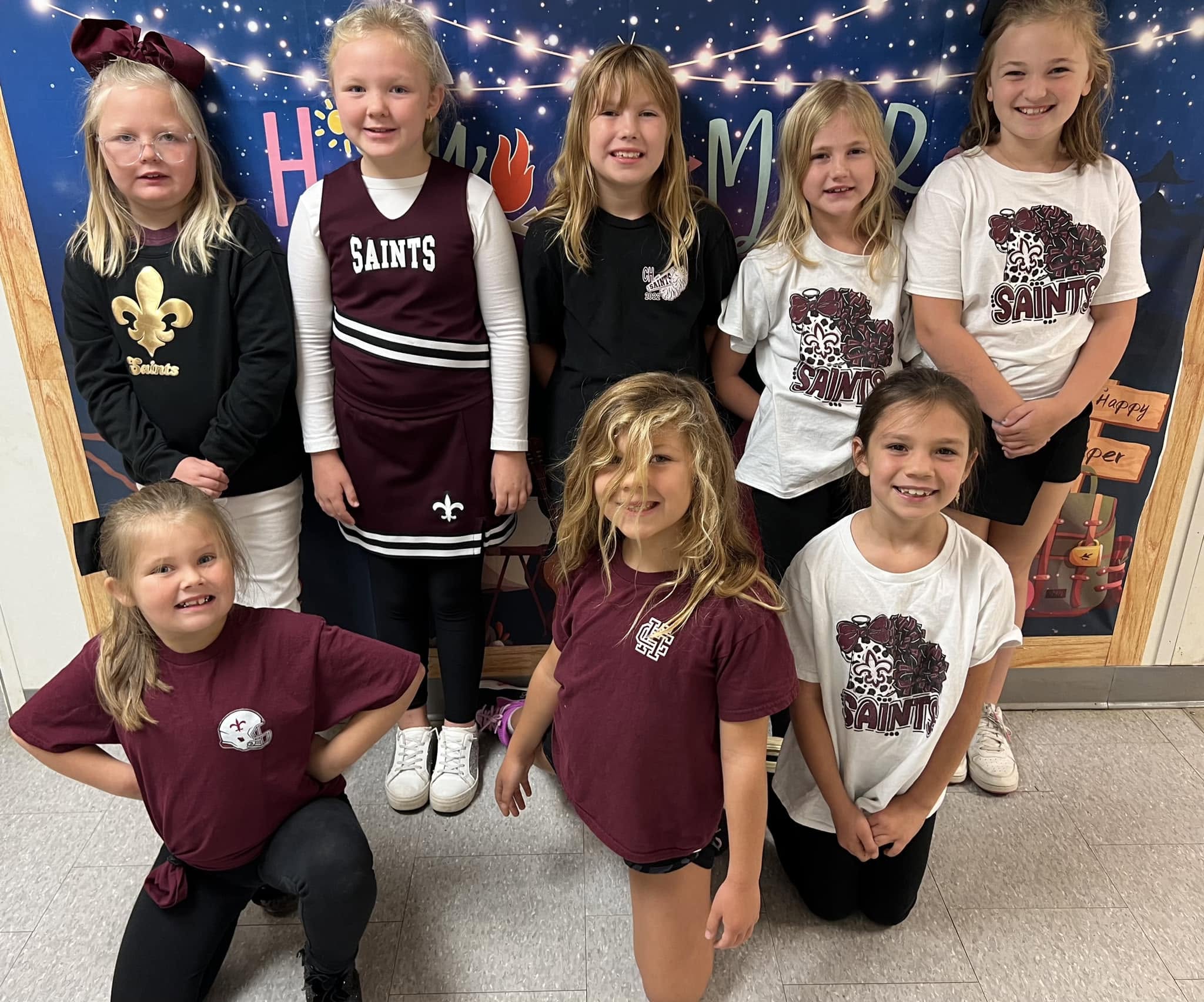 Clarendon Hall Lower School students smiling together in Saints spirit wear