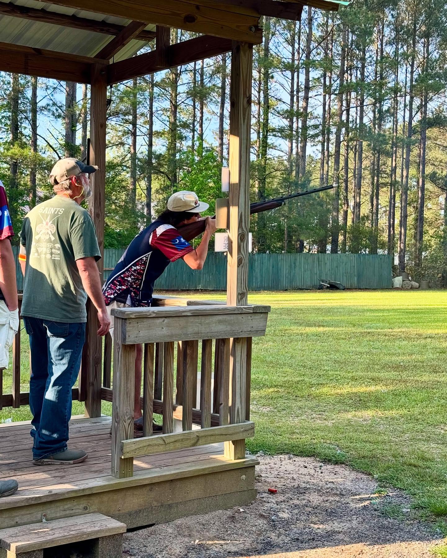 Clarendon Hall Sporting Clays athlete at a course station alongside an adult