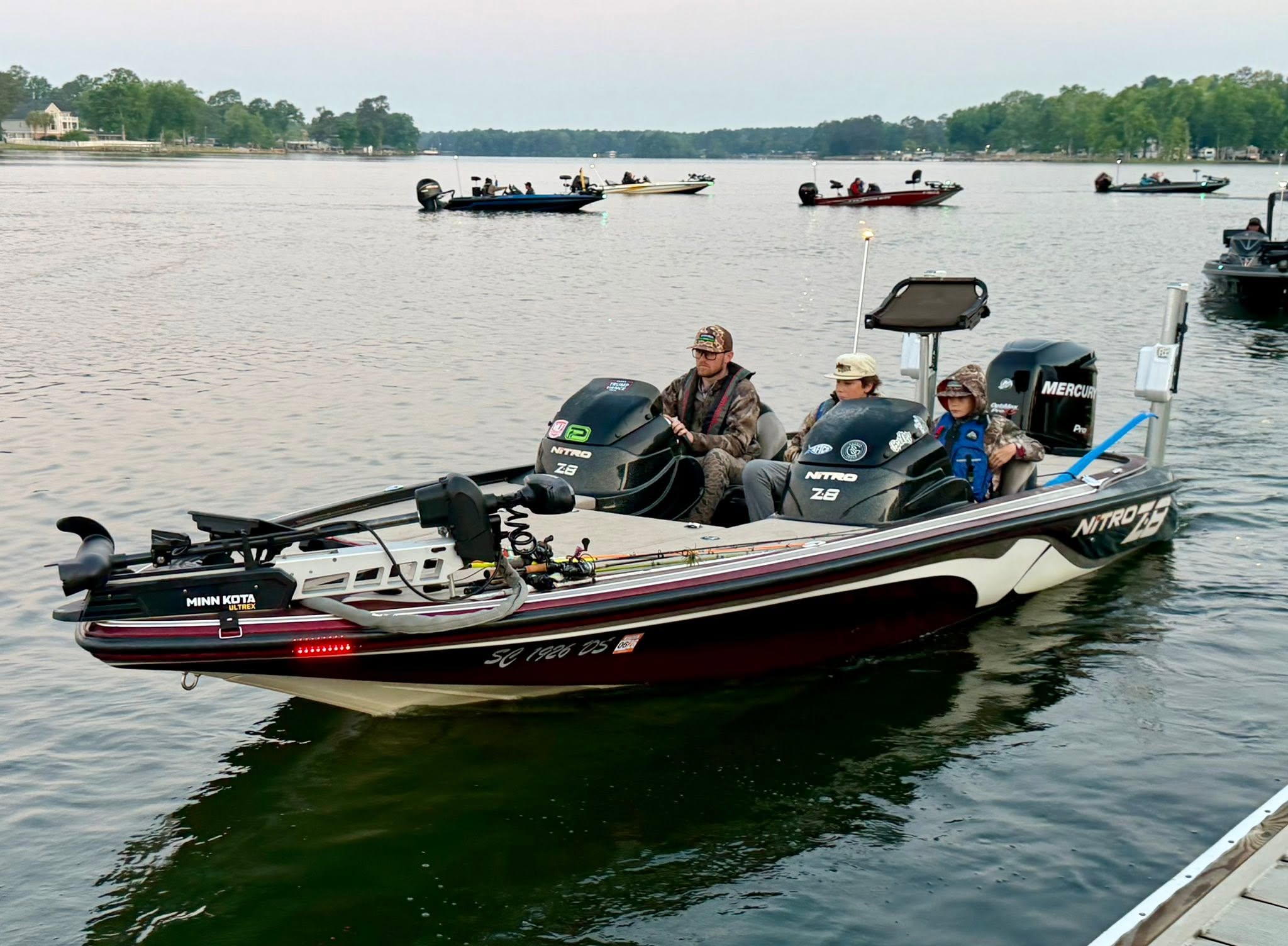 Clarendon Hall Bass Fishing Team members arriving by boat on tournament day