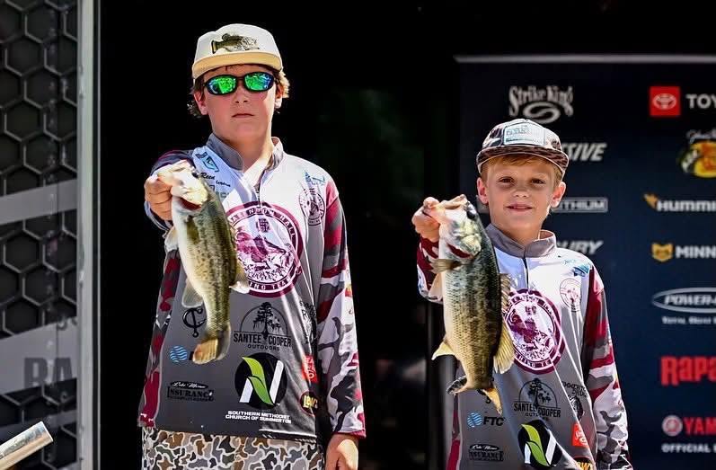 Two Clarendon Hall anglers displaying their catch