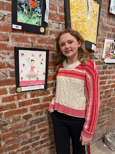 Clarendon Hall student displaying artwork