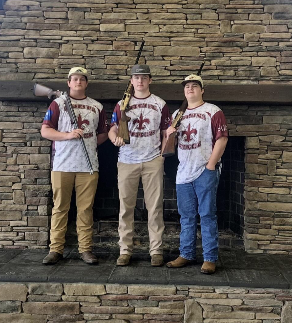 Three Clarendon Hall Sporting Clays team members in team uniforms.